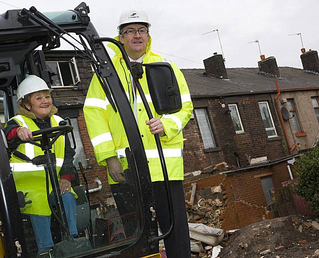 Cllr Doreen Brophy-Lee gets the demolition underway under supervision by John Freeley of J Freeley Ltd. 