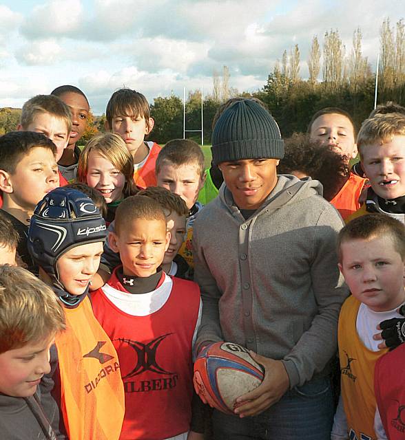 St Helens ace Kyle Eastmond talks with local youngsters at October's Half Term Total Rugby Camp.