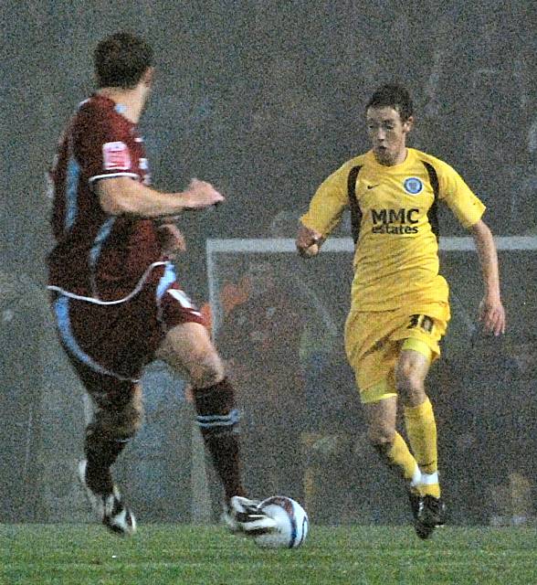 Will Buckley attacks the Scunthorpe back line.