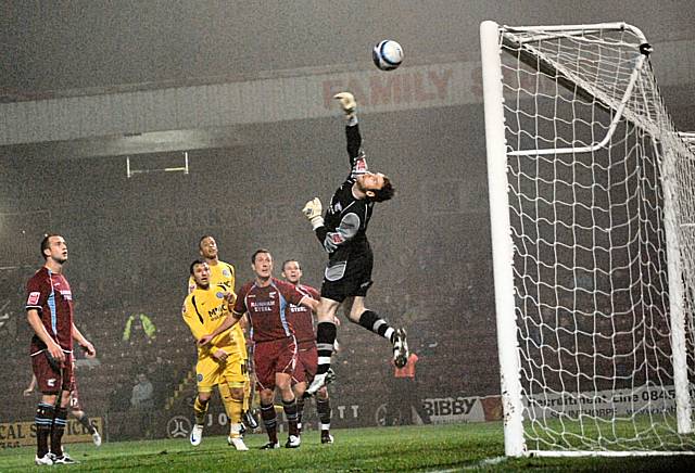 Joe Murphy turns away Will Buckley's curling shot.