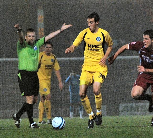 Buckley is given an advantage by the referee as he drives forward.