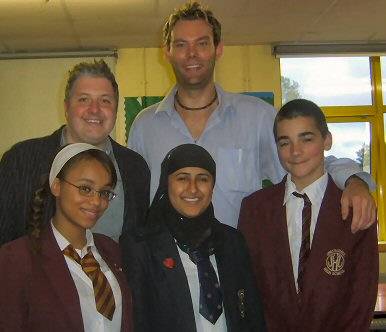 Councillor Dale Mulgrew with Teacher Andy Kennedy and pupils from Springhill High School