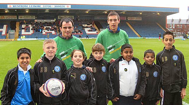 Youngsters from Belfield Community and Heybrook Primary Schools with Dale stars Chris Dagnall and Will Buckley on 'Kick It Out' day at Spotland.