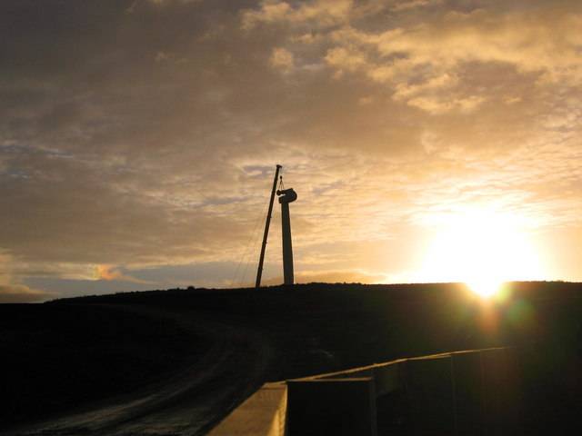 The construction of one of the turbines at sundown.