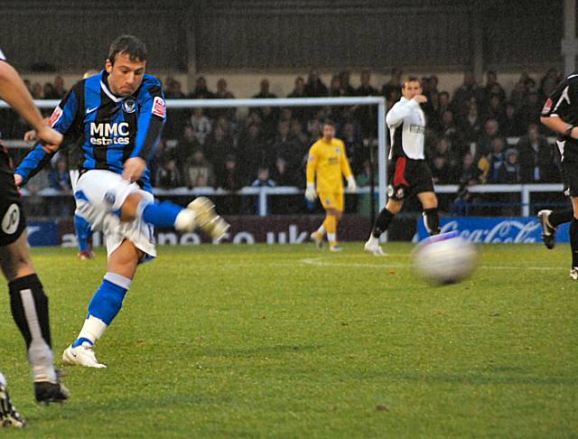 Adam Le Fondre fires in an early shot.