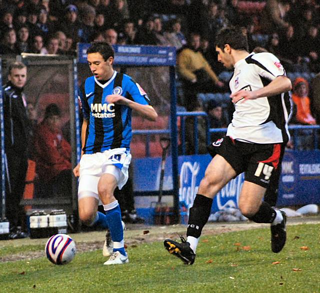 Will Buckley tries to get past Danny Holland.