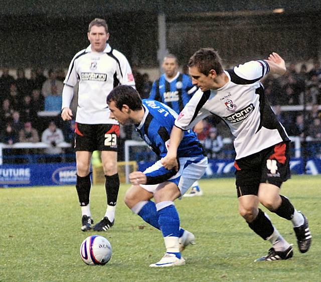 Le Fondre holds off Shaun Cooper.