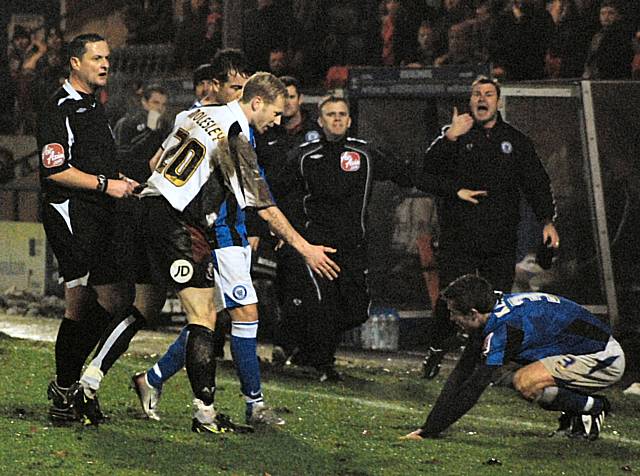 Mark Molesley checks on the condition of Tom Kennedy after flooring the Dale full back with a late tackle.