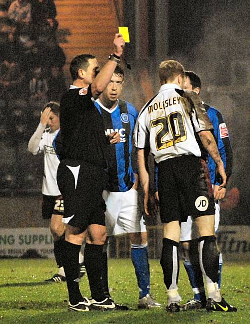 Molesley sees yellow for the tackle.