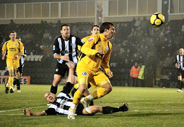 Le Fondre had the ball in the net from this chance but the linesman adjudged the striker to have post the Forest Green defender.