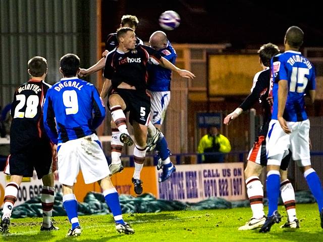 Shrewsbury clear the ball as McEvilly charges in (Rochdale v Shrewsbury 26-12-08)