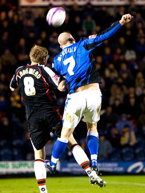 McEvilly wins a header above Kelvin Langmead (Rochdale v Shrewsbury 26-12-08)