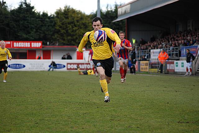 Chris Dagnall chases the ball down as Dale attack once more