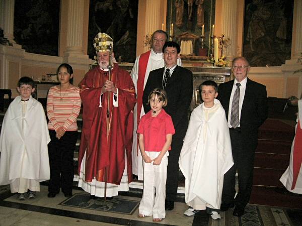 Archbishop Paul Gallagher, the Apostolic Nuncio to Burundi and parishioners of St Joseph’s Heywood confirmed at Mass with Father Paul Daly in the background and Heywood MP Jim Dobbin on the right