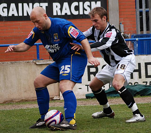 Danny Adams holds the ball up against Higginbotham