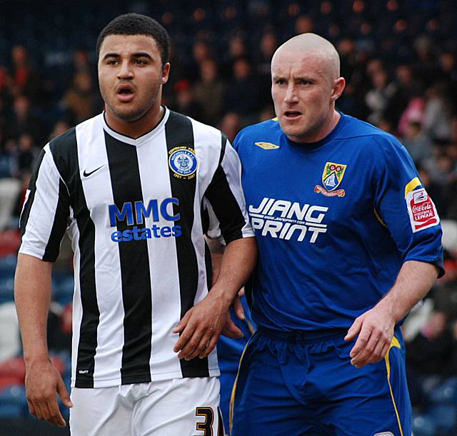 Marcus Holness and Wayne Curtis await a Dale corner