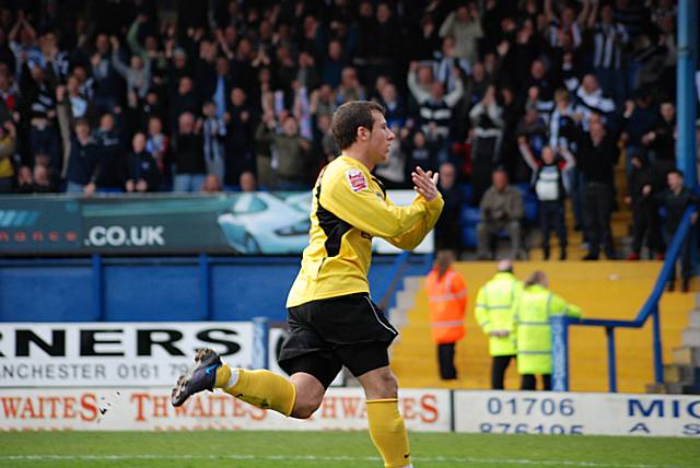 Le Fondre wheels away after scoring Dale's equaliser from the penalty spot