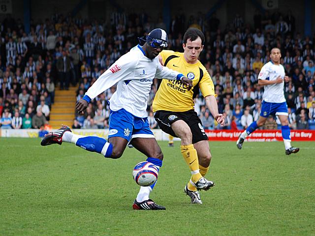 Efe Sodje clears the ball from Chris Dagnall