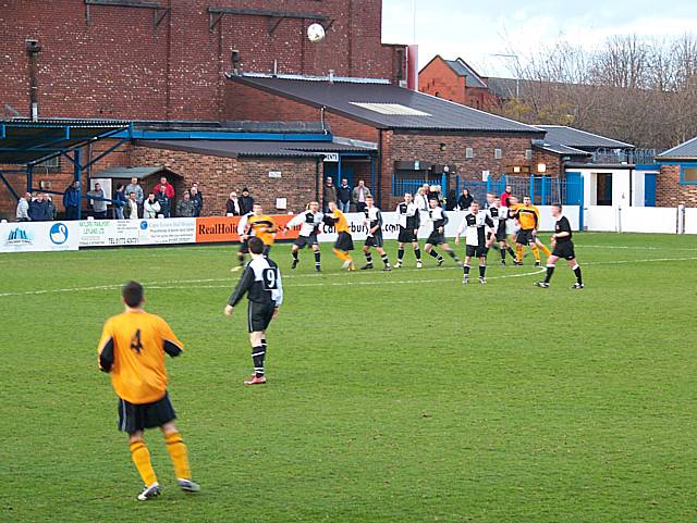 Match action: Byron Milne puts a Plough free kick into the danger zone