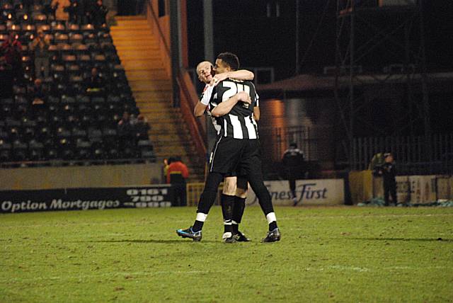 Gary Jones and Rene Howe celebrate after the latter opened the scoring