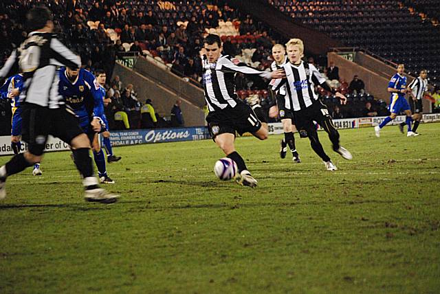 Adam Rundle shoots to score Rochdale's second