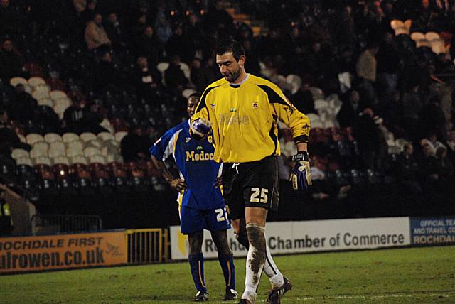 Michael Johnson and Russell Hoult look back in disbelief after the own goal