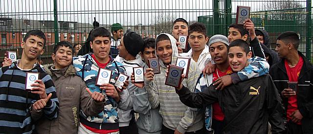 Some of players show off the winners and runners-up trophies