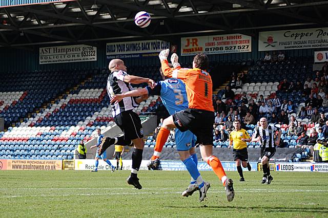 Lee Thorpe was injured in this clash with Grimsby's goalkeeper