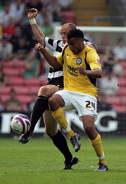 White gets ahead of Howe to win the ball for Darlington