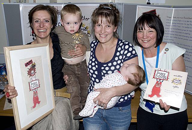 Val Finigan (right) is pictured launching the book with artist Lou Gardiner (left), who is displaying one of the original embroidered pieces of artwork she created for the book, and mum Angela Collinge with children George and Nell.