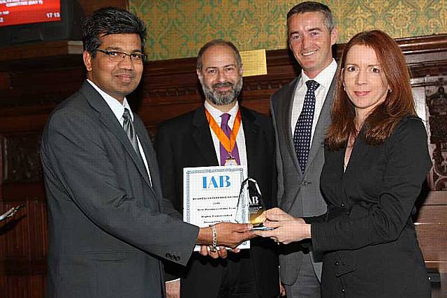 Anasudhin Azeez, Managing Director of New Asian Media Ltd, receives the New Business of the Year award from BBC's Rachel Elnaugh as IAB President Fabian Hamilton, MP, and Alan Moody, Managing Director of Mamut Business Software, look on