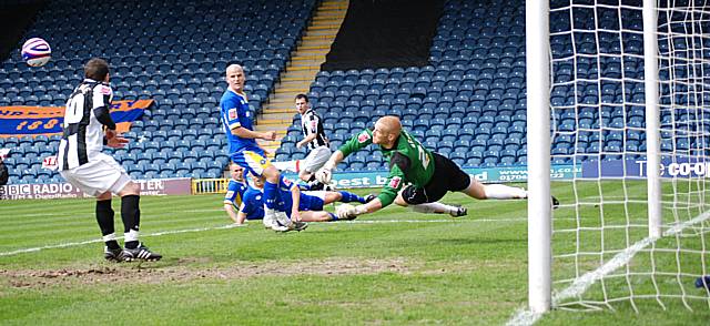 Scott Bevan palms out Chris Dagnall's shot