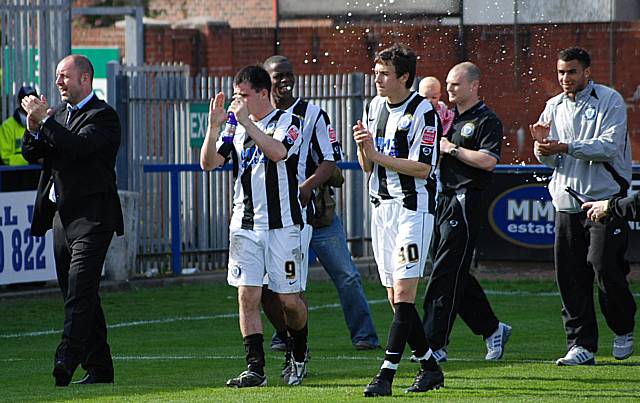 Keith Hill leads the Dale players on a lap of honour