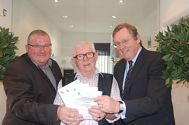 Dr Paul Griffiths from Durnford Dermatology, patient Vinny Gillespie, and John Pierce, Chair of Heywood, Middleton and Rochdale Primary Care Trust