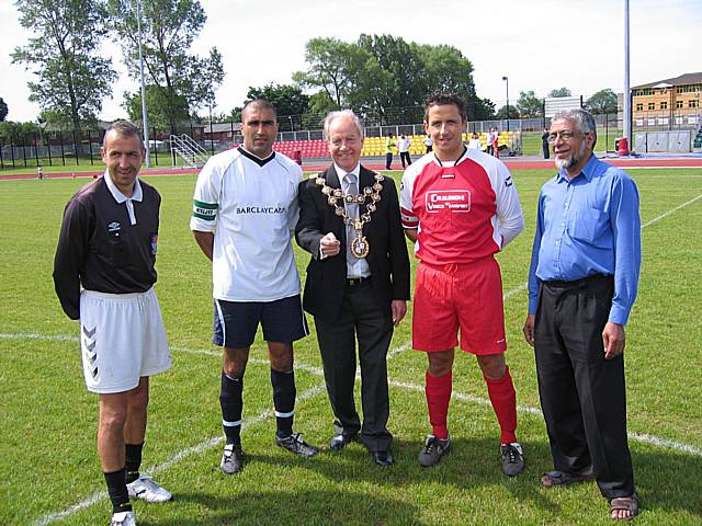 Rochdale Mayor Robin Parker as the two team captains, the referee and councillor Sharif look on