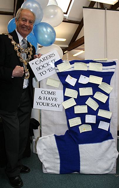 The Mayor of Rochdale, Councillor Robin Parker, with the ‘carers sock it to ‘em’ sock