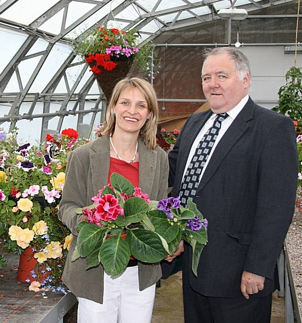 Councillor Wera Hobhouse and Head of Environmental Management, Peter Cunningham, stand amongst the blooms at Bowlee Nursery