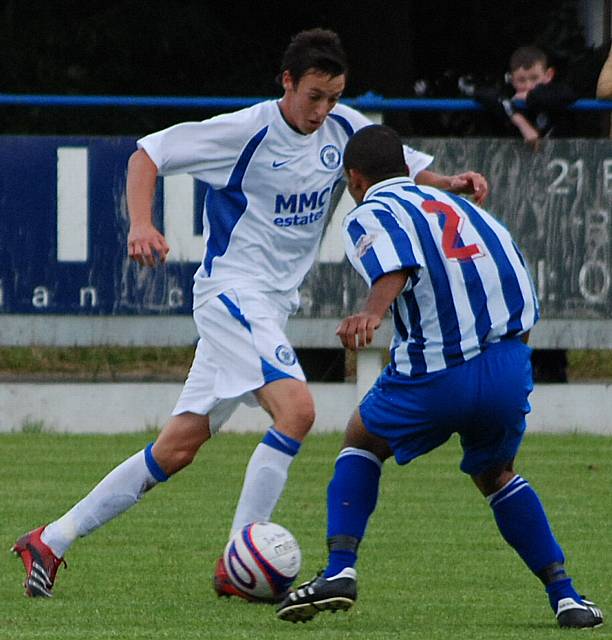 Will Buckley takes on a Rossendale defender