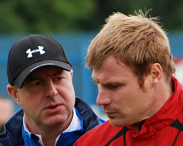 Keith Hill and David Flitcroft in discussion at half time