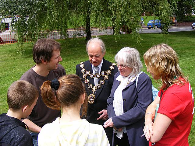 Magician with Mayor and Mayoress of Rochdale with young people looking on