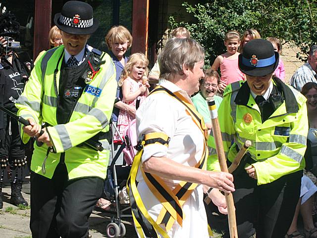 Littleborough Rushbearing Festival and the  Earl of Stamford Morris dancers with help from the police