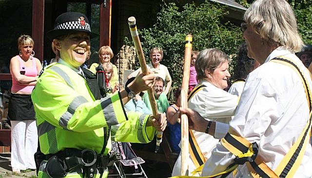 Littleborough Rushbearing Festival and the Earl of Stamford Morris dancers helping the police with new baton training 