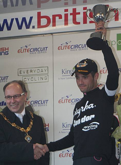 Chris Newton celebrates his Rochdale Grand Prix win this year with Deputy Mayor Councillor Keith Swift.