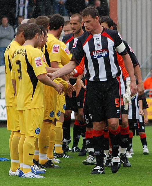 The teams line up for the pre-match handshake as part of a new FA initiative to encourage fair play