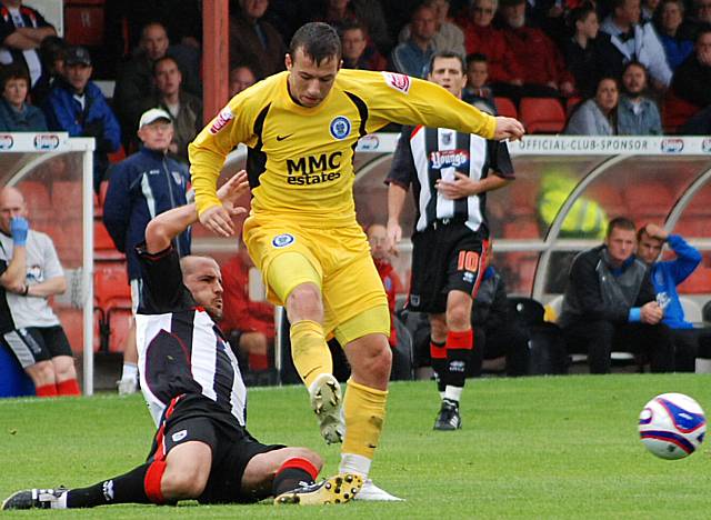 Richard Hope tackles Le Fondre as he is about to shoot