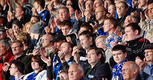 Dale fans applaud during the minute's celebration of Cooksey's life