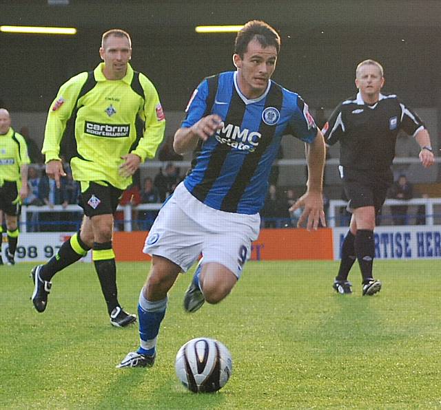 Chris Dagnall heads towards goal