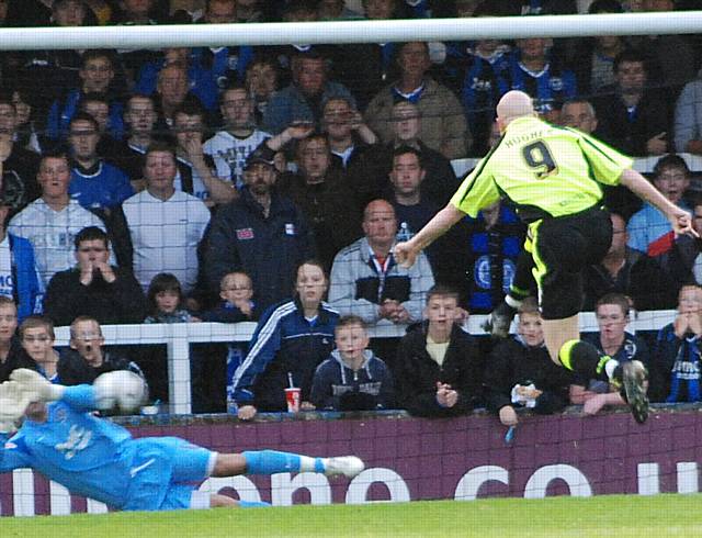 Sam Russell saves Lee Hughes' penalty in the first half