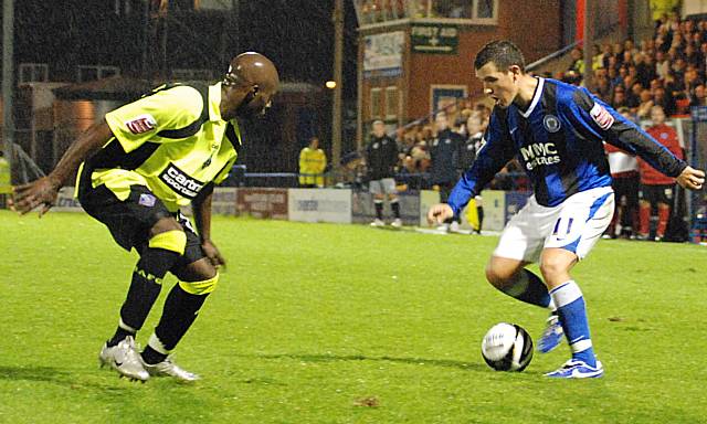 Adam Rundle looks to get past Reuben Hazell