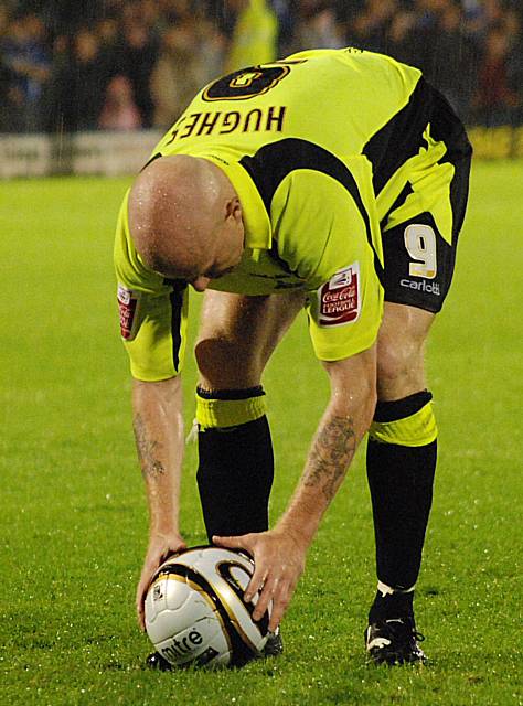 Lee Hughes puts the ball on the spot before stepping up to score Oldham's winning penalty